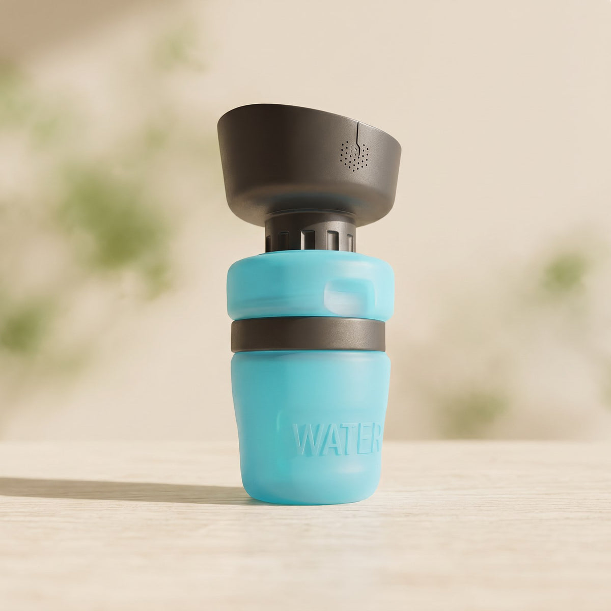 Pet Drinking Water Bottle on a warm neutral background